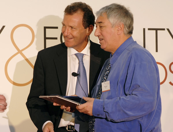 John Flanner MBE receiving the Outstanding Achievement Award at the first National Civil Service Awards ceremony in 2006.  From left to right: Sir Gus Oâ€™Donnell and John Flanner MBE.