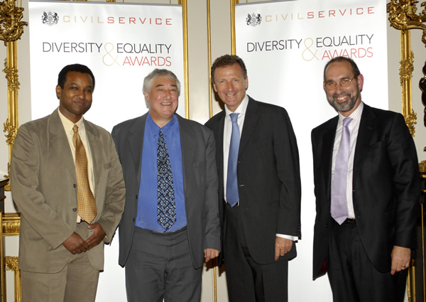 Winning an Award at the National Civil Service Equality and Diversity Awards ceremony in 2006.  From left to right: BBC Reporter Rageh Omaar, John Flanner MBE, Sir Gus Oâ€™Donnell, and former HMRC Chairman, Paul Gray.